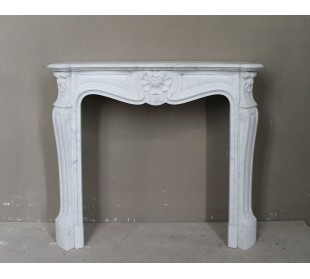 Antique white marble Baroque-style fireplace dating back to the 19th century. This marble mantel is called “Trois Coquilles.”