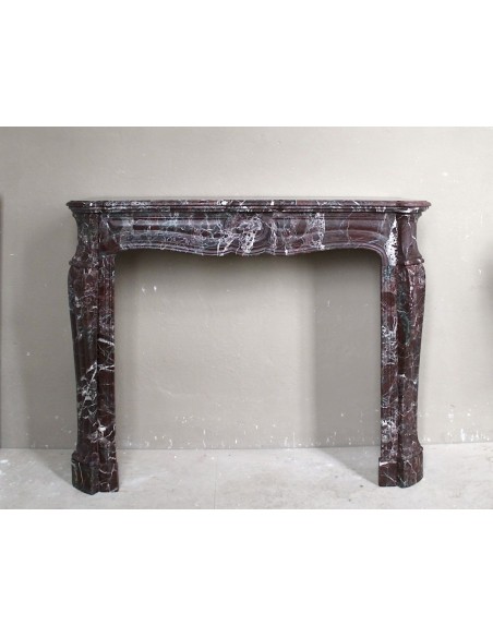 Antique Levanto Red marble fireplace mantel carved in the 19th century, belonging to the Pompadour family.