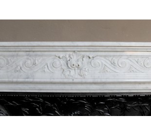 Antique Neoclassical white marble fireplace with floral decorations and “snail” elements, with its original cast iron insert. 2