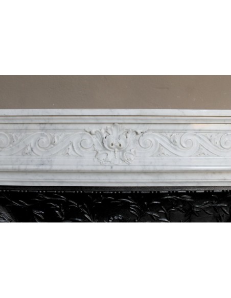 251 AG NEOCLASSICAL "ESCARGOT" FIREPLACE MANTEL CARVED OUT OF WHITE CARRARA MARBLE PROVIDED WITH ITS ORIGINAL CAST IRON INSERT