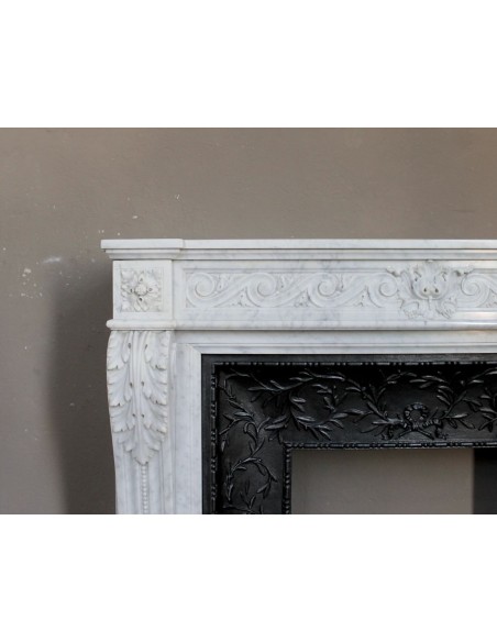 251 AG NEOCLASSICAL "ESCARGOT" FIREPLACE MANTEL CARVED OUT OF WHITE CARRARA MARBLE PROVIDED WITH ITS ORIGINAL CAST IRON INSERT