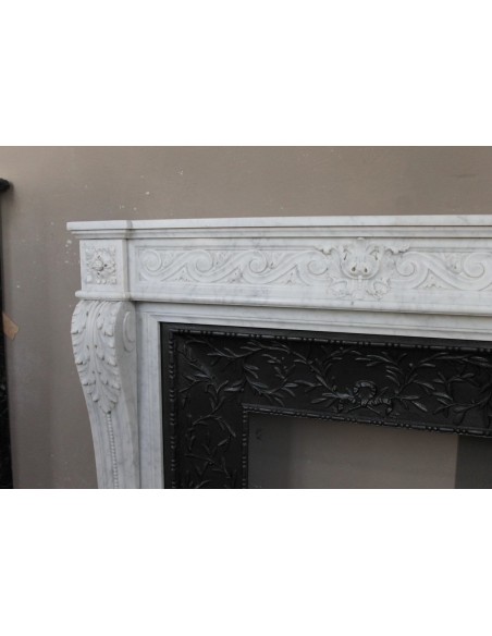 251 AG NEOCLASSICAL "ESCARGOT" FIREPLACE MANTEL CARVED OUT OF WHITE CARRARA MARBLE PROVIDED WITH ITS ORIGINAL CAST IRON INSERT