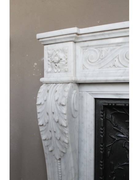 251 AG NEOCLASSICAL "ESCARGOT" FIREPLACE MANTEL CARVED OUT OF WHITE CARRARA MARBLE PROVIDED WITH ITS ORIGINAL CAST IRON INSERT