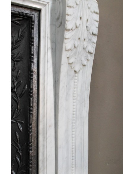 251 AG NEOCLASSICAL "ESCARGOT" FIREPLACE MANTEL CARVED OUT OF WHITE CARRARA MARBLE PROVIDED WITH ITS ORIGINAL CAST IRON INSERT