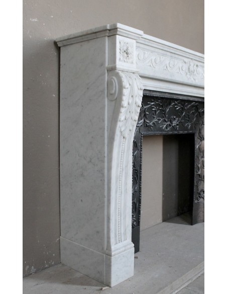 251 AG NEOCLASSICAL "ESCARGOT" FIREPLACE MANTEL CARVED OUT OF WHITE CARRARA MARBLE PROVIDED WITH ITS ORIGINAL CAST IRON INSERT