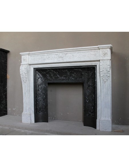 251 AG NEOCLASSICAL "ESCARGOT" FIREPLACE MANTEL CARVED OUT OF WHITE CARRARA MARBLE PROVIDED WITH ITS ORIGINAL CAST IRON INSERT