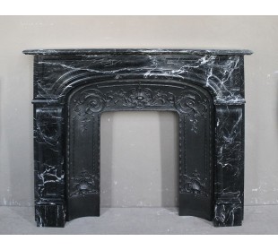 Antique fireplace carved out of black Marquinia marble, with white veins, elegant and impressive.