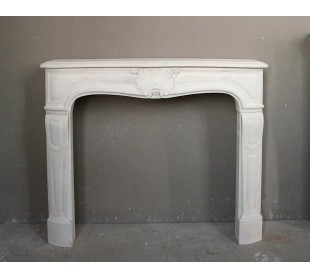 Antique Pierre Dorée stone fireplace mantel of Louis XV style, baroque and ornate, dating back to the 19th century.