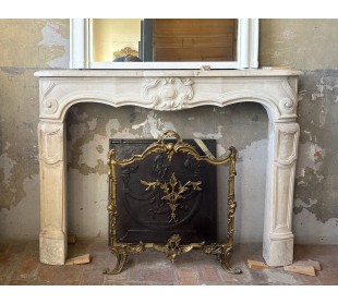 Antique baroque-style fireplace mantel carved in Beaujolais stone.