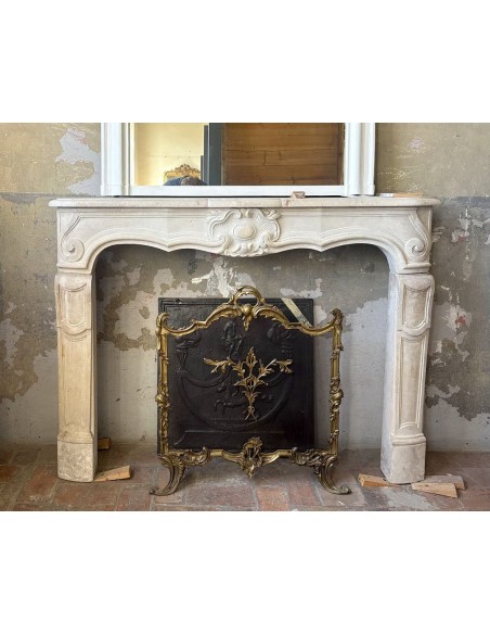 Antique baroque-style fireplace mantel carved in Beaujolais stone.