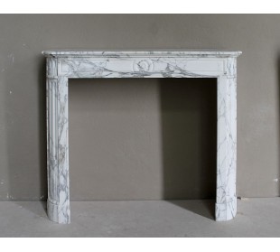Antique neoclassical mantel carved in white Arabescato marble with very finely carved floral decorations.