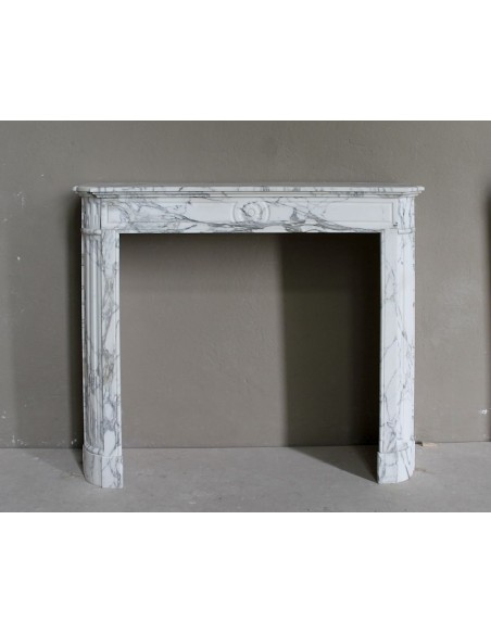 Antique neoclassical mantel carved in white Arabescato marble with very finely carved floral decorations.