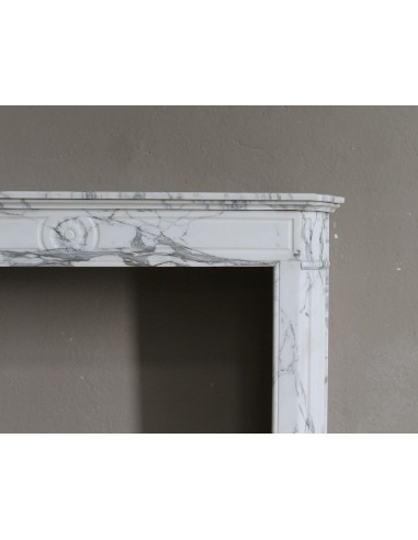 Antique neoclassical mantel carved in white Arabescato marble with very finely carved floral decorations.