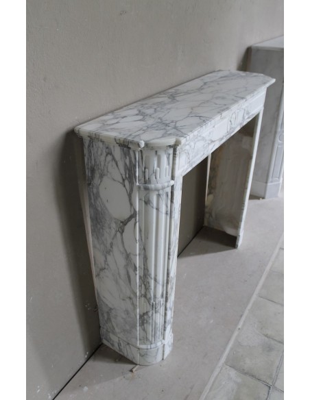 216 LOUIS XVI “DÉMI-LUNE MARGUERITE” FIREPLACE MANTEL IN STUNNING WHITE ARABESCATO MARBLE