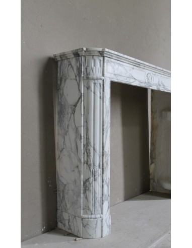 Antique neoclassical mantel carved in white Arabescato marble with very finely carved floral decorations.