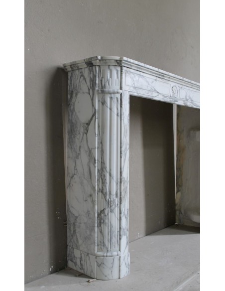 Antique neoclassical mantel carved in white Arabescato marble with very finely carved floral decorations.