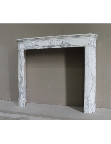Antique neoclassical mantel carved in white Arabescato marble with very finely carved floral decorations.