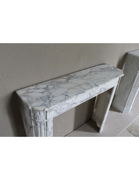 216 LOUIS XVI “DÉMI-LUNE MARGUERITE” FIREPLACE MANTEL IN STUNNING WHITE ARABESCATO MARBLE