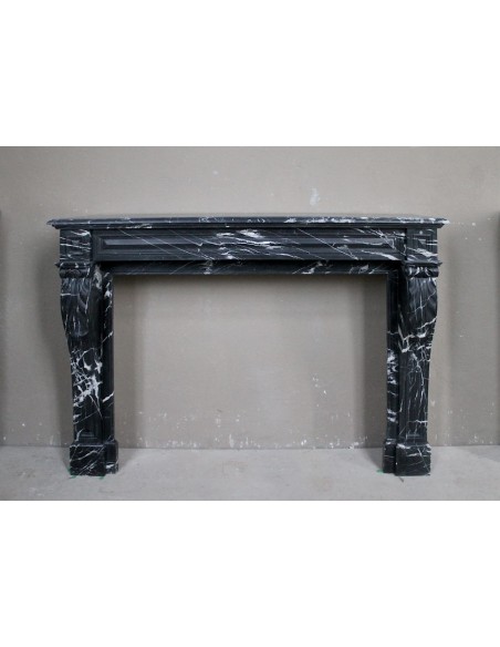 Antique fireplace in black Marquinia marble, a model called "Diamond Tip". This is a truly antique marble mantel.