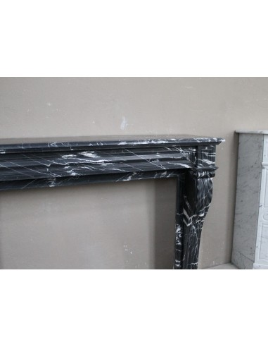 Antique fireplace in black Marquinia marble, a model called "Diamond Tip". This is a truly antique marble mantel.