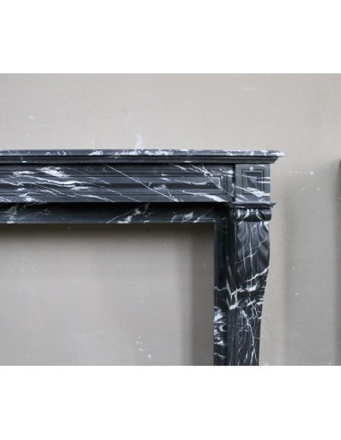 Antique fireplace in black Marquinia marble, a model called "Diamond Tip". This is a truly antique marble mantel.