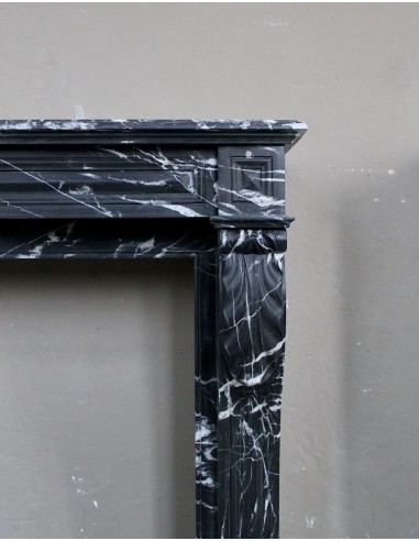 Antique fireplace in black Marquinia marble, a model called "Diamond Tip". This is a truly antique marble mantel.