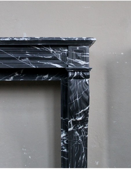 Antique fireplace in black Marquinia marble, a model called "Diamond Tip". This is a truly antique marble mantel.