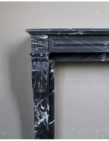 Antique fireplace in black Marquinia marble, a model called "Diamond Tip". This is a truly antique marble mantel.