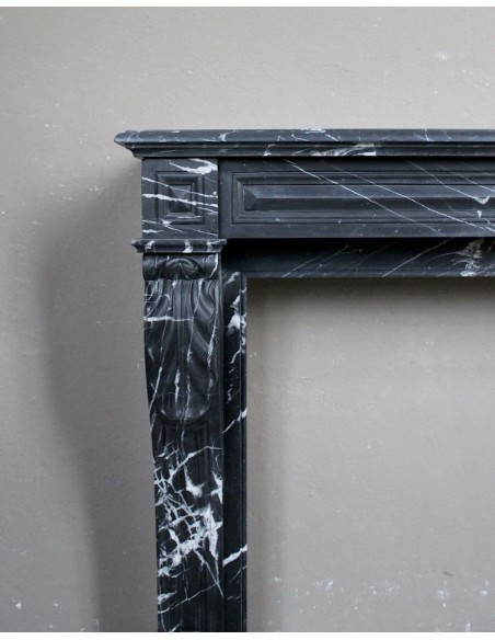 Antique fireplace in black Marquinia marble, a model called "Diamond Tip". This is a truly antique marble mantel.