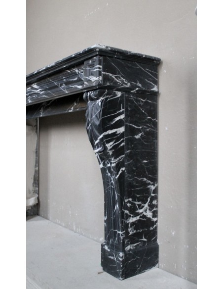 Antique fireplace in black Marquinia marble, a model called "Diamond Tip". This is a truly antique marble mantel.