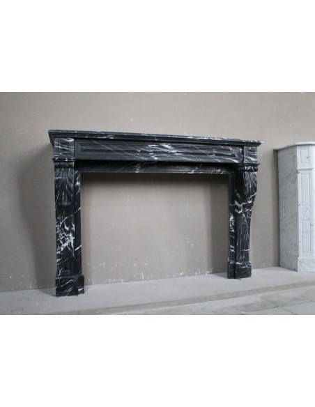 Antique fireplace in black Marquinia marble, a model called "Diamond Tip". This is a truly antique marble mantel.