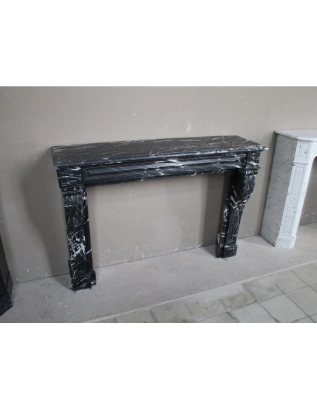 Antique fireplace in black Marquinia marble, a model called "Diamond Tip". This is a truly antique marble mantel.