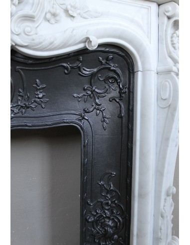 Exceptional antique Baroque fireplace mantel in white marble with floral carvings and its original cast iron insert.