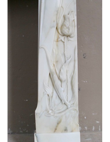 Art Nouveau “Fleur de Chardon” mantel in white marble and signed Majorelle. This marble fireplace is extremely rare and refined.
