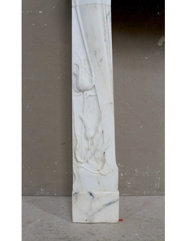 Art Nouveau “Fleur de Chardon” mantel in white marble and signed Majorelle. This marble fireplace is extremely rare and refined.