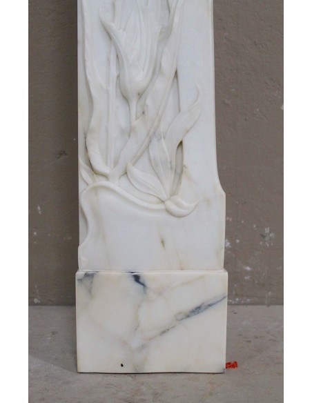 Art Nouveau “Fleur de Chardon” mantel in white marble and signed Majorelle. This marble fireplace is extremely rare and refined.