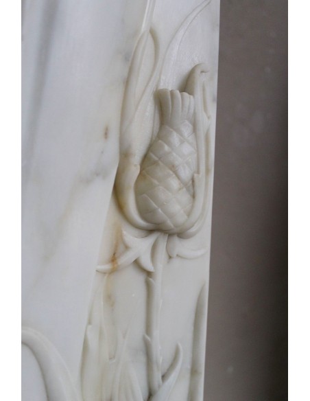 Art Nouveau “Fleur de Chardon” mantel in white marble and signed Majorelle. This marble fireplace is extremely rare and refined.