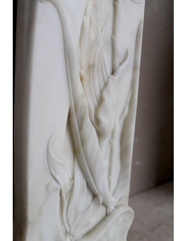 Art Nouveau “Fleur de Chardon” mantel in white marble and signed Majorelle. This marble fireplace is extremely rare and refined.