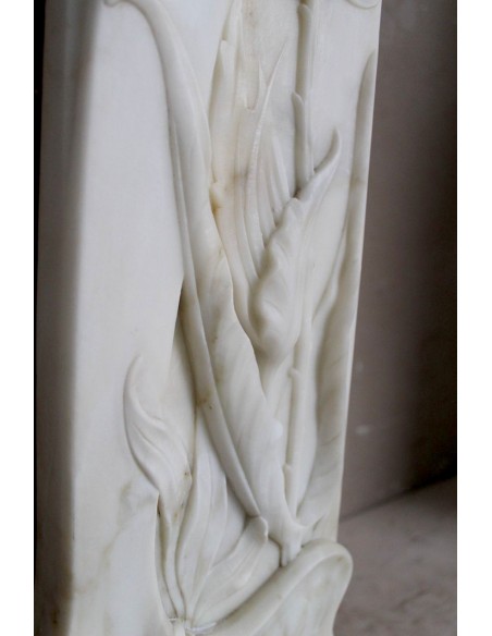Art Nouveau “Fleur de Chardon” mantel in white marble and signed Majorelle. This marble fireplace is extremely rare and refined.