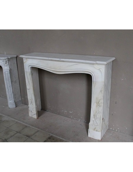 Art Nouveau “Fleur de Chardon” mantel in white marble and signed Majorelle. This marble fireplace is extremely rare and refined.
