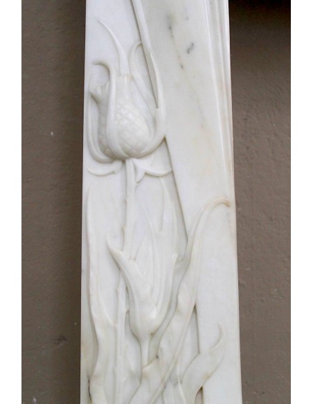 Art Nouveau “Fleur de Chardon” mantel in white marble and signed Majorelle. This marble fireplace is extremely rare and refined.