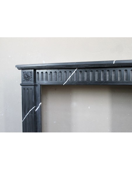 Neoclassical “Deux Roses” fireplace mantel carved in Black Marquinia marble with white veins, a true little gem.