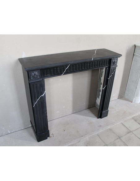 Neoclassical “Deux Roses” fireplace mantel carved in Black Marquinia marble with white veins, a true little gem.
