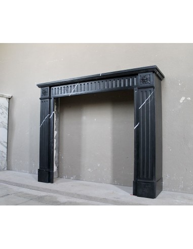 Neoclassical “Deux Roses” fireplace mantel carved in Black Marquinia marble with white veins, a true little gem.