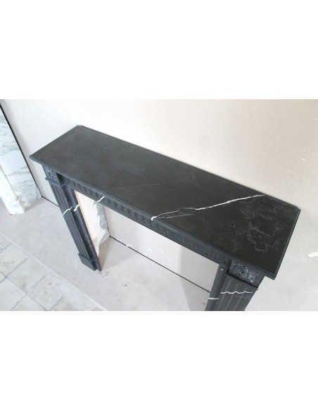 Neoclassical “Deux Roses” fireplace mantel carved in Black Marquinia marble with white veins, a true little gem.