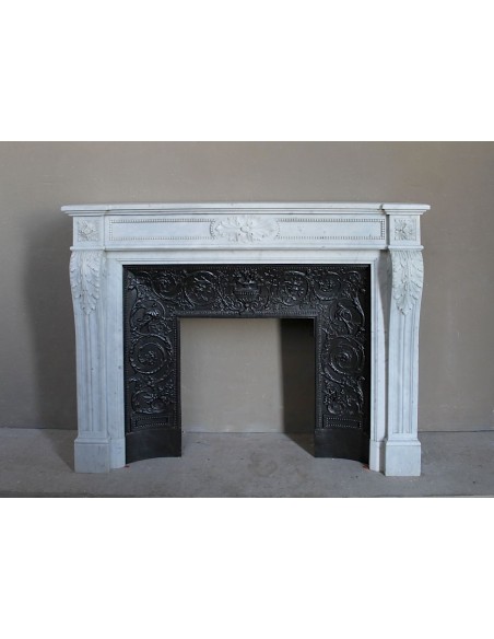 Antique Louis XVI "Trois Fleurs Perlé" fireplace mantel in white Carrara marble, with its original elegant cast iron insert.