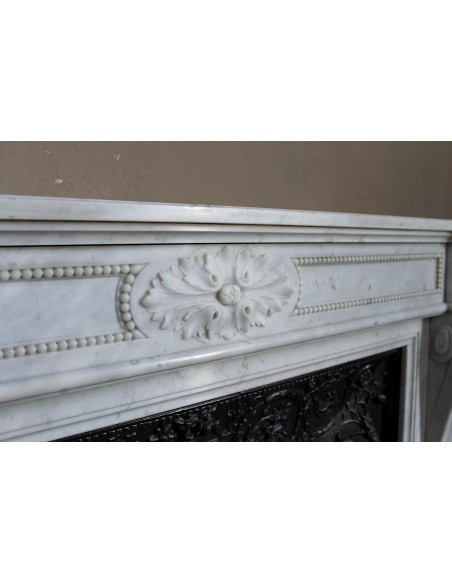 Antique Louis XVI "Trois Fleurs Perlé" fireplace mantel in white Carrara marble, with its original elegant cast iron insert.