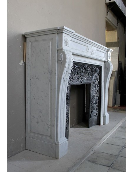 Antique Louis XVI "Trois Fleurs Perlé" fireplace mantel in white Carrara marble, with its original elegant cast iron insert.