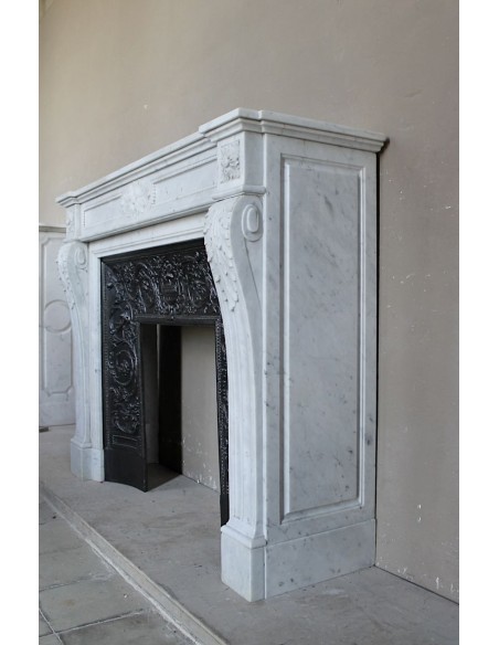 Antique Louis XVI "Trois Fleurs Perlé" fireplace mantel in white Carrara marble, with its original elegant cast iron insert.