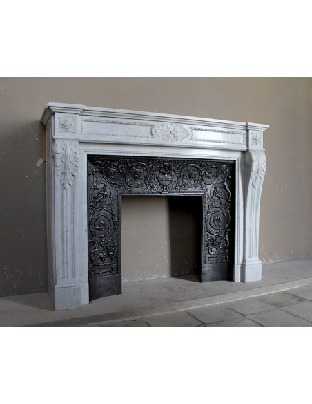 Antique Louis XVI "Trois Fleurs Perlé" fireplace mantel in white Carrara marble, with its original elegant cast iron insert.